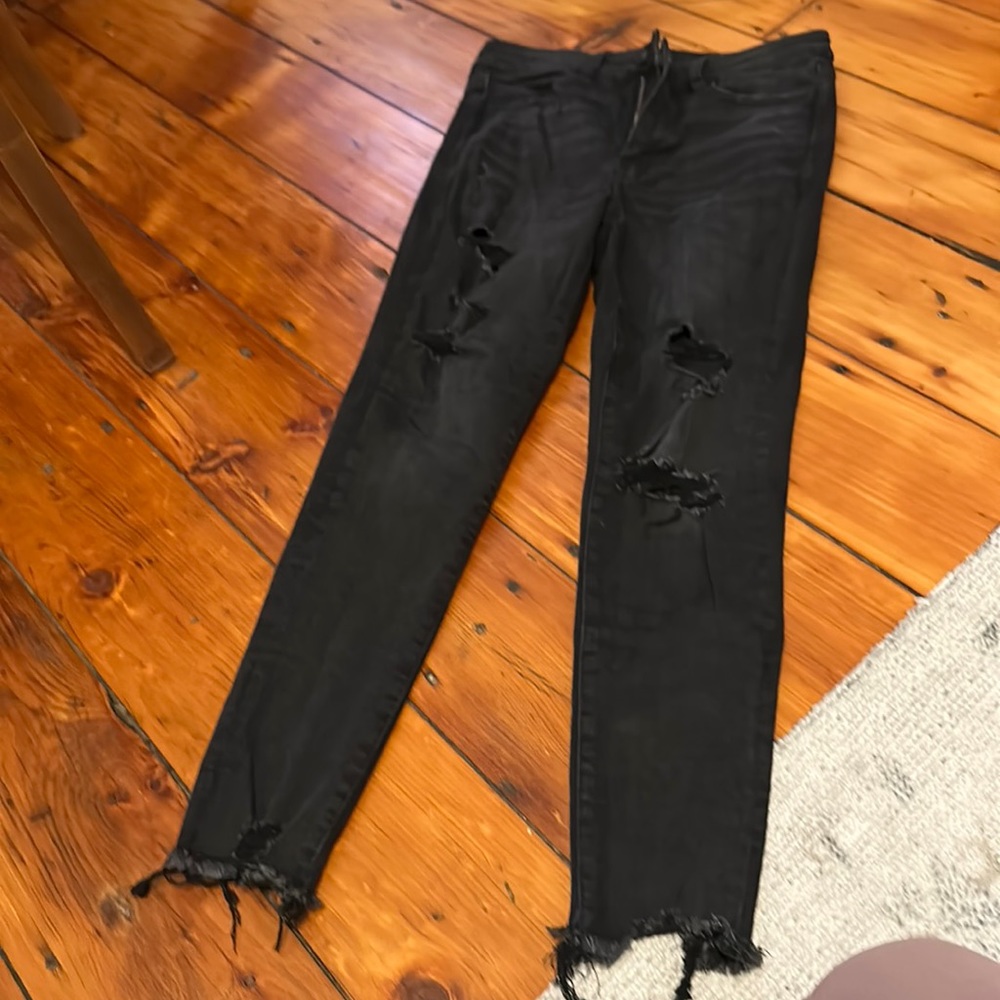 American eagle black ripped jeans. Size 8. Next level stretch. Never worn.